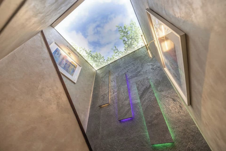 Unique outdoor shower with skylight and colorful ambient lighting effects
