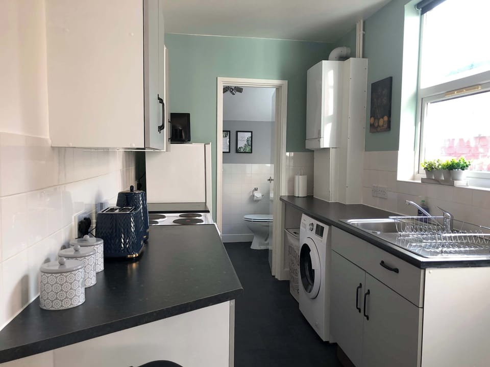 Kitchen: Bright and airy with modern appliances for culinary adventures!