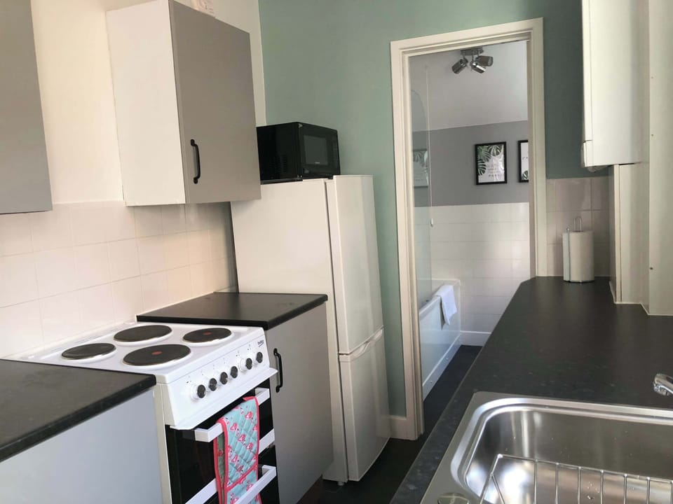 Kitchen: Modern and bright, perfect for culinary adventures and casual dining!