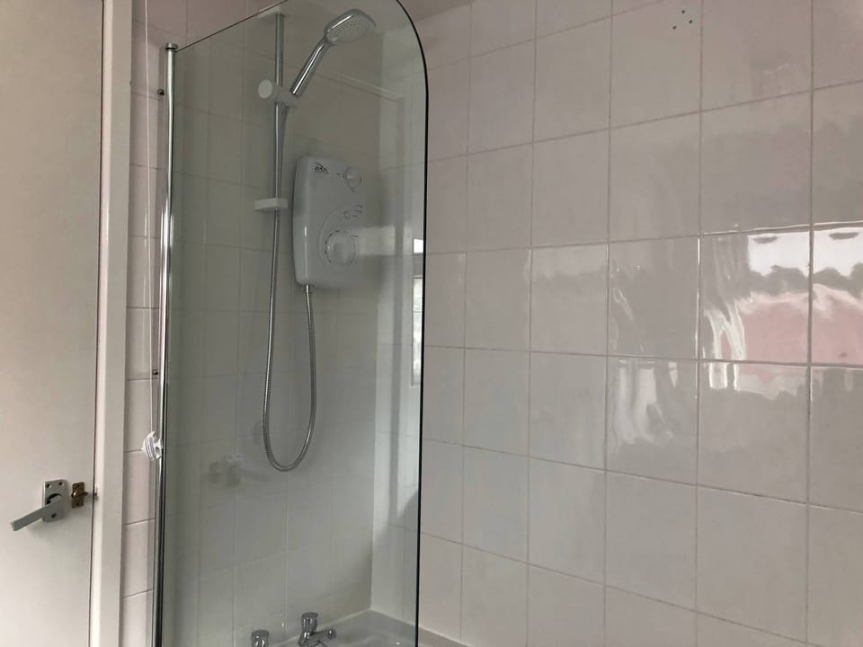 Shower Room: Refresh with a modern shower featuring sleek tiles and inviting light!