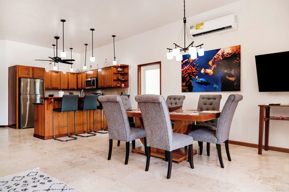 Gather around the beautiful wood table with quick access to the fully equipped kitchen