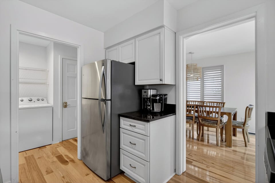 Your kitchen offers bright cabinetry, sleek appliances, and an open flow to the dining area—perfect for preparing meals and gathering with loved ones.