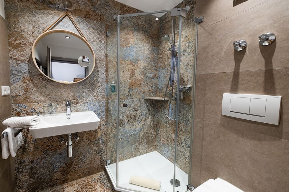 Double Room, Balcony, Lake View | Bathroom | Shower, eco-friendly toiletries, hair dryer, towels
