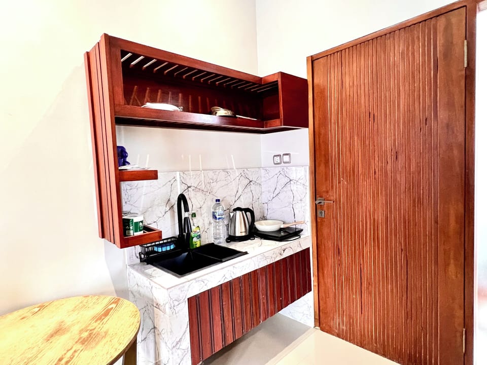Deluxe Double Room, Balcony, Pool View | Private kitchen | Electric kettle, cleaning supplies