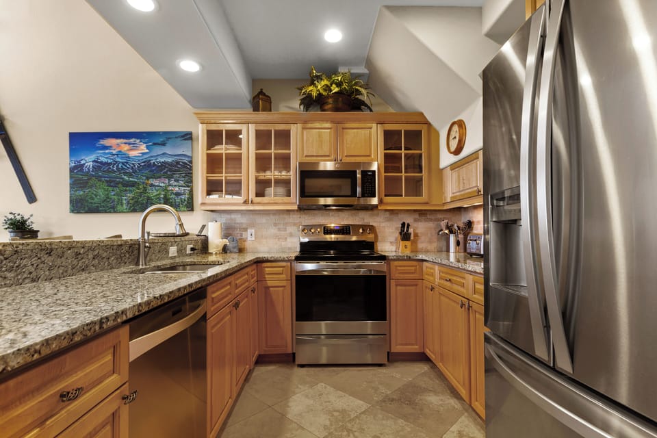 Granite countertops, stainless appliances, and a fully equipped kitchen.