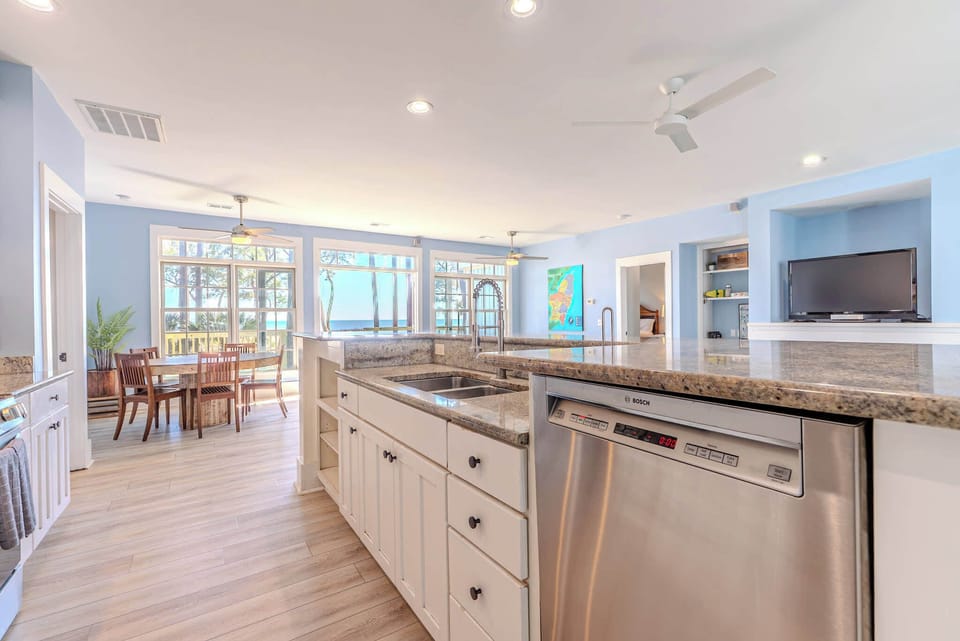 Granite island, Bosch steel, ocean glimpsed through sun-drenched windows — 152 Ave of Oaks delivers chef-worthy elegance where Hilton Head's coastal light turns every morning into something extraordinary.