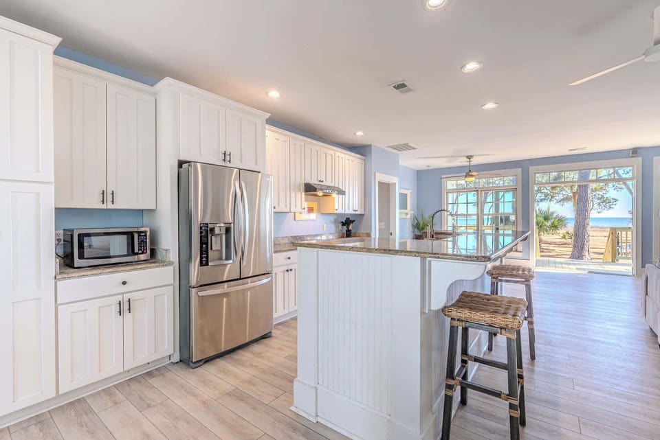 Coastal living at its finest — sun-drenched interiors, granite counters & ocean views frame every moment at 152 Ave of Oaks. Your Hilton Head escape awaits.