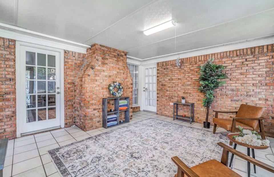 Sun room off of living room with direct access to master