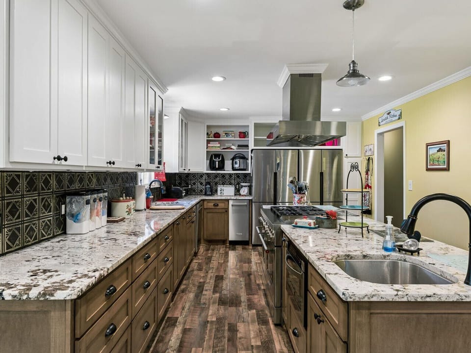 Well stocked kitchen with ice maker, double fridge, large stove