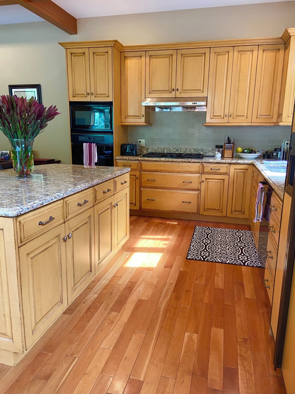 Kitchen-well stocked with appliances, utensils, spices, pots and pans.