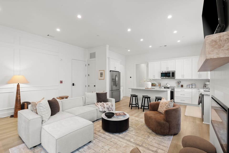 Bright open-concept living room and modern kitchen with island seating