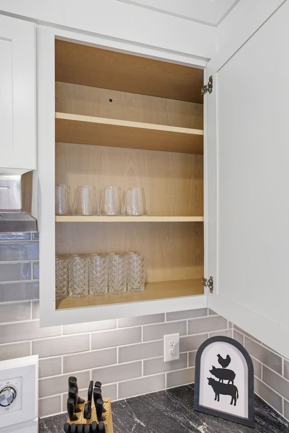 Modern, fully equipped kitchen with sleek finishes, island seating, extra bar space, and a dedicated coffee nook—bright, stylish, and perfect for effortless meals.