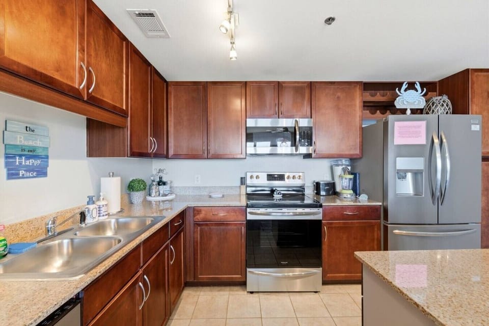 Spacious kitchen featuring granite countertops and everything needed for home-cooked meals.