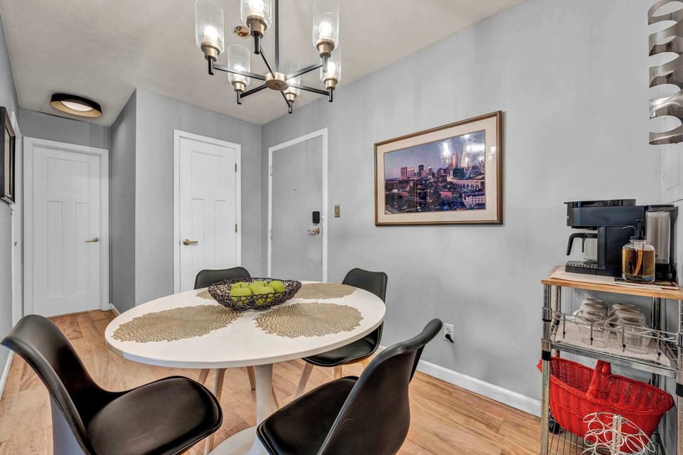 Dining area w/ round table seating & wall art for a homey touch.