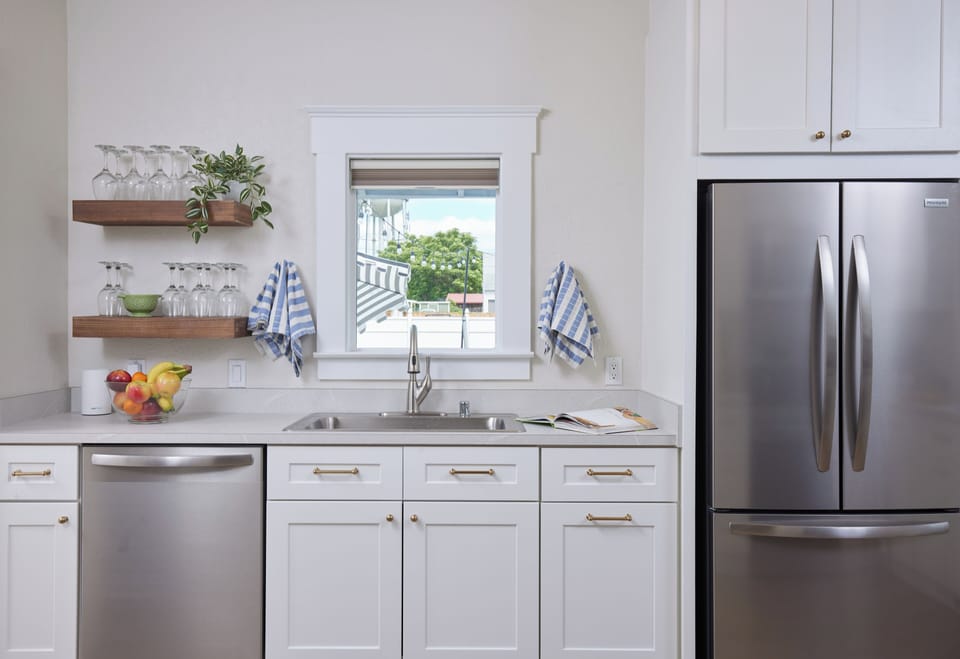 Full kitchen with stainless appliances and ample counter space.