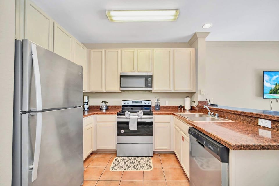 Fully equipped kitchen with silver appliances