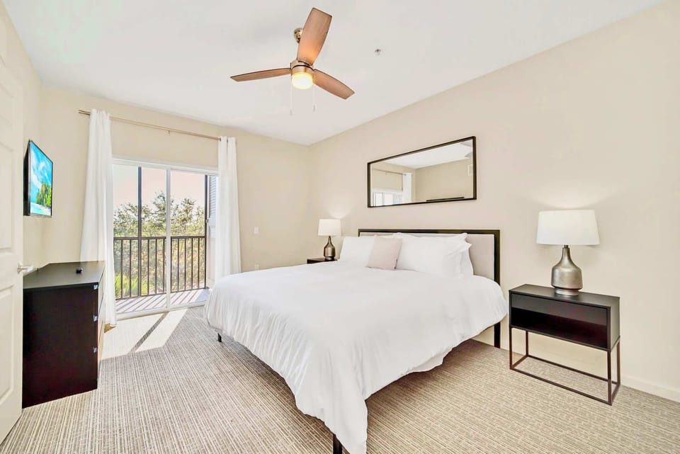 King bedroom with smart TV and en-suite bathroom