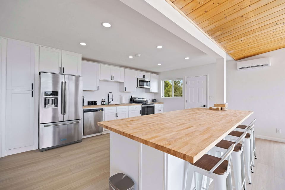 Sleek modern kitchen with natural wood accents 💫