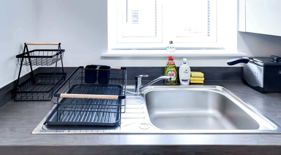Functional kitchen layout with practical appliances and workspace designed for convenience during busy working weeks.