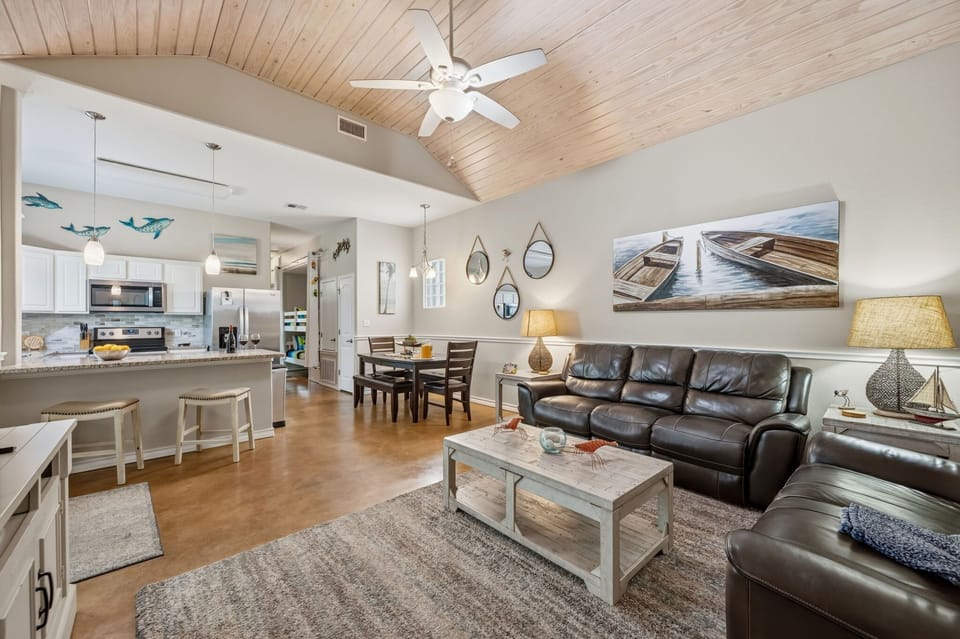 Open-Concept Living, Dining & Kitchen with Vaulted Wood Ceiling