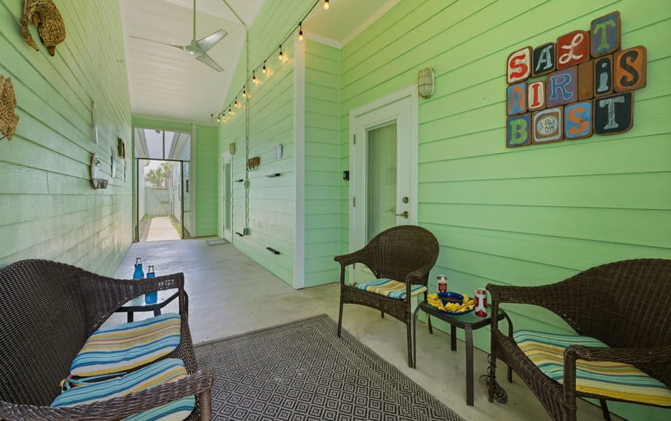 Covered Back Porch — String Lights, Ceiling Fan & Wicker Seating