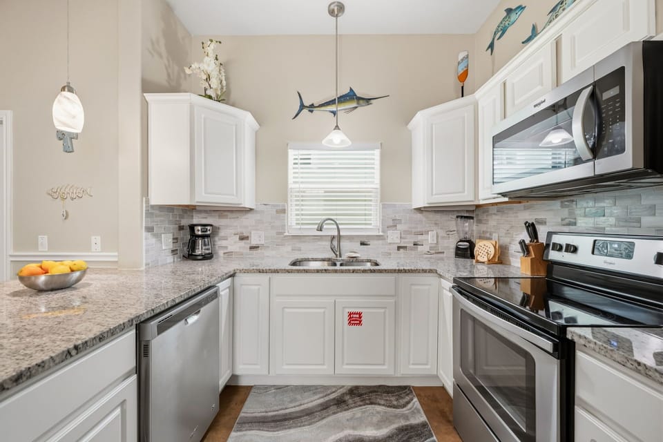 Kitchen — White Cabinets, Stainless Appliances & Tile Backsplash