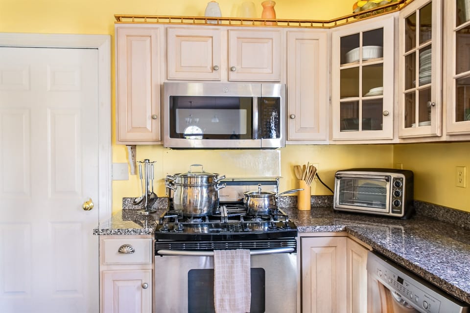 Find everything you need for home-cooked meals, including a large lobster pot and professional cookware. This fully stocked kitchen at Seven Peaks Ridge is designed to handle group catering with ease during your Acadia National Park vacation.