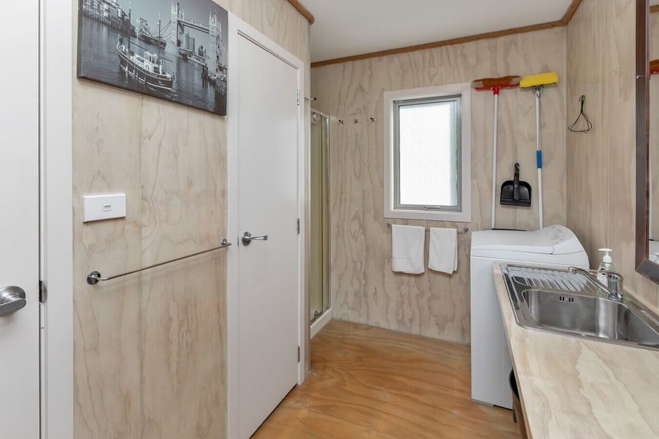 Compact bathroom, toilet and laundry area