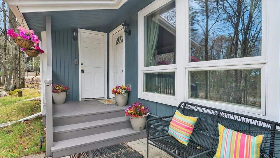 Welcoming Front Porch Entry with Seating & Decor