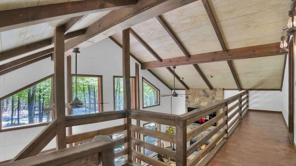 Open Loft Walkway with Vaulted Wood Ceilings
