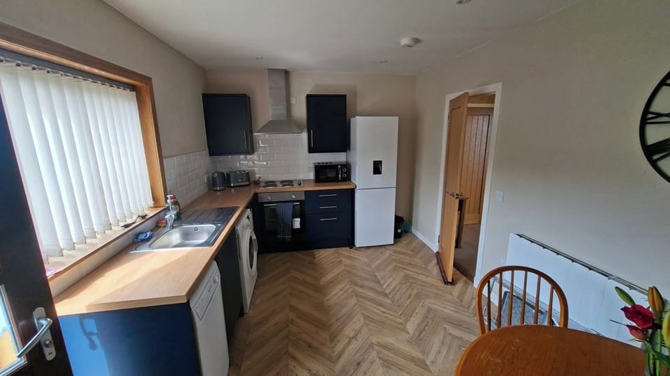 Fully fitted kitchen, with dining table and chairs 