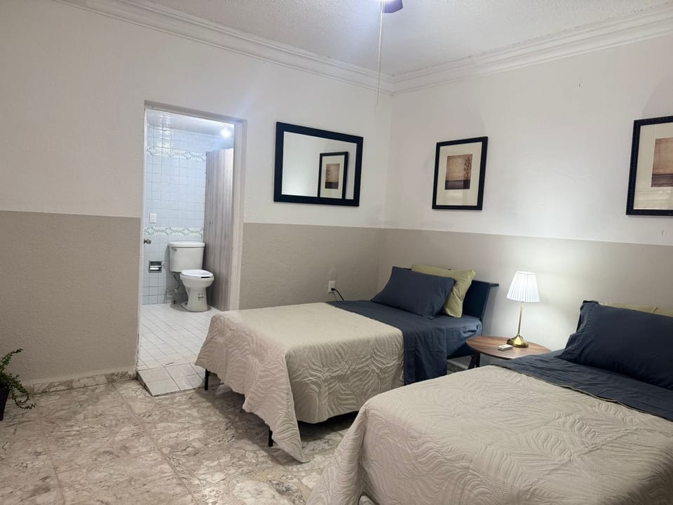 Basic Double Room, 2 Queen Beds | Desk, laptop workspace, WiFi (free)