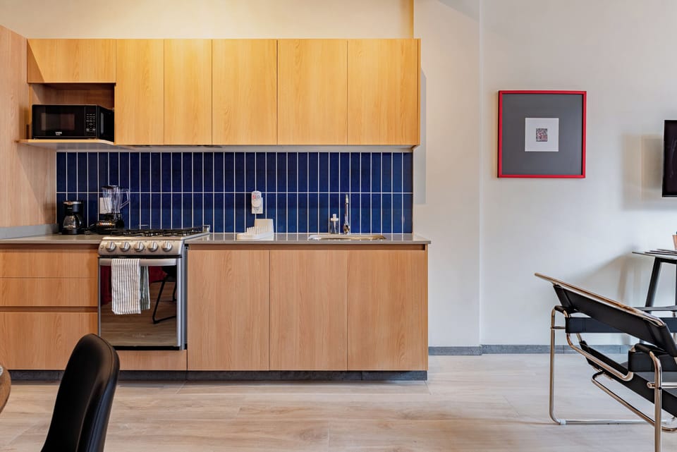 Luxury Apartment | Private kitchen | Full-size fridge, microwave, oven, stovetop
