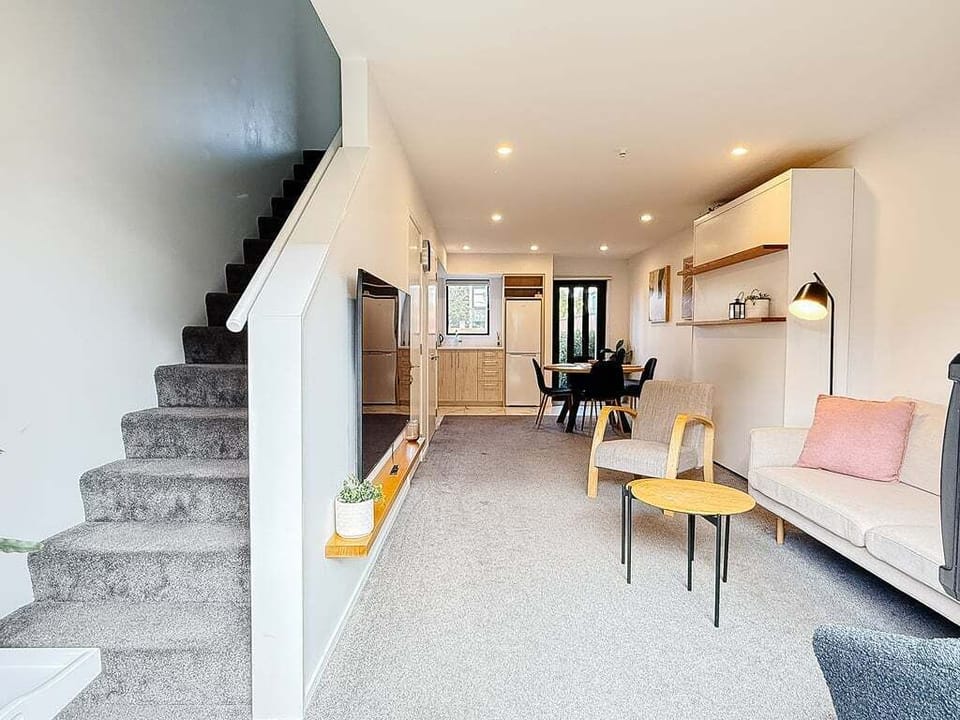 The layout makes sense from the moment you walk in — bedrooms and bathroom upstairs, living and kitchen down.