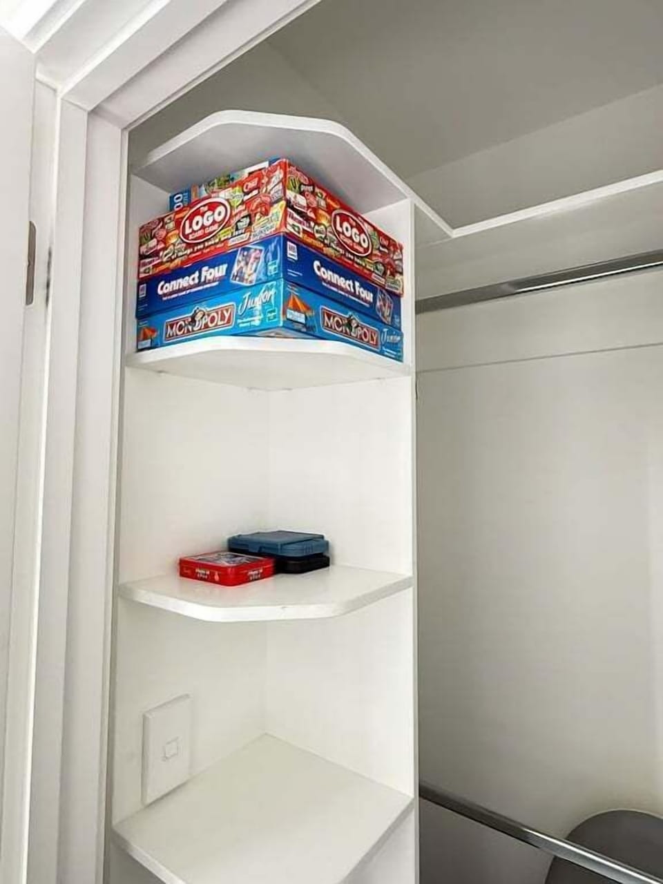 A shelf of board games for the evenings when no one can agree on a film.