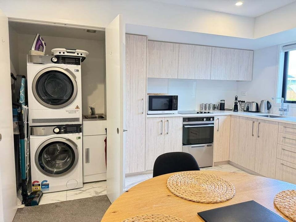 Washer and separate dryer tucked into the laundry nook — unpack properly if you're staying a while.