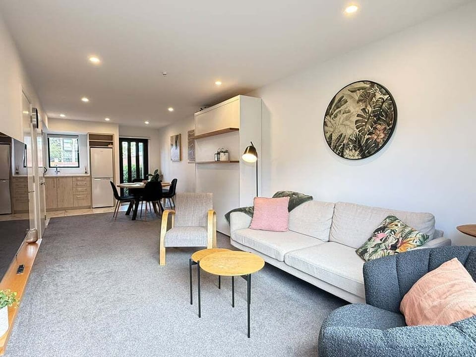 Living area with murphy bed folded up, showing the full open-plan space.