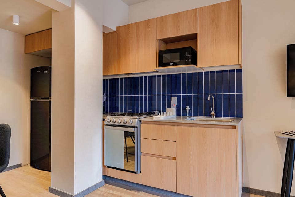 Family Apartment | Private kitchen | Full-size fridge, microwave, oven, stovetop