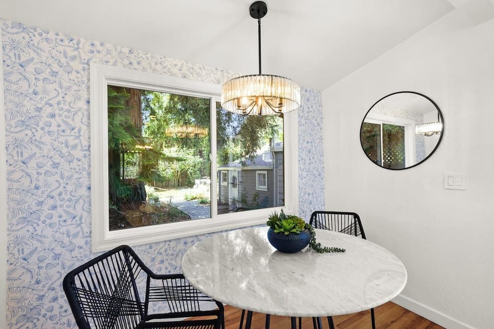 Dining area with stylish seating, natural light, and the perfect space to gather for meals, coffee, or wine nights.