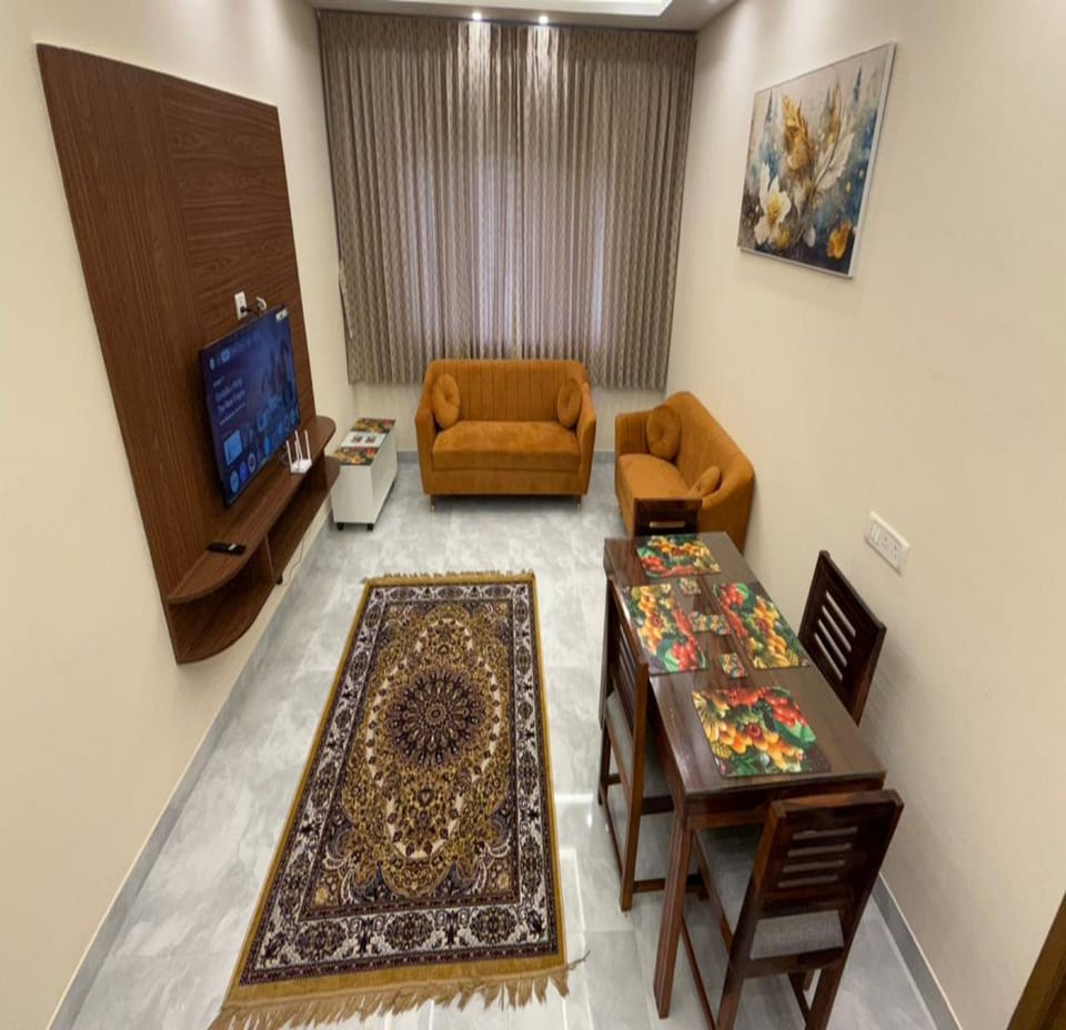 Family Apartment | Living area | 32-inch LCD TV with cable channels