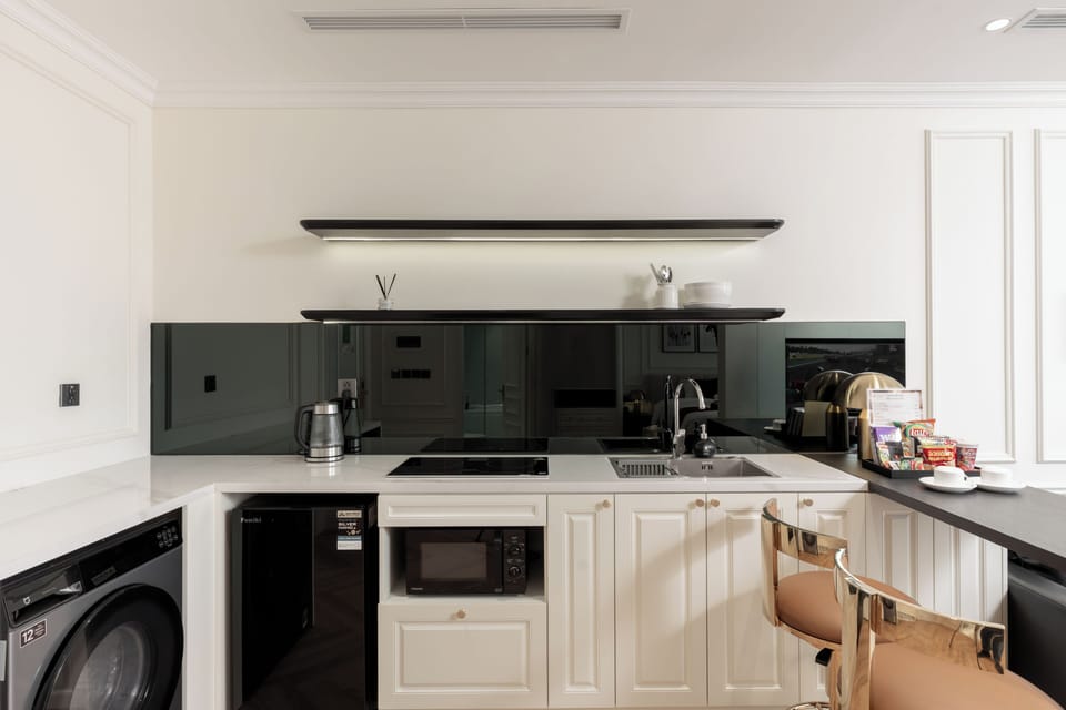 Luxury Suite, Balcony, City View | Private kitchen | Mini-fridge, microwave, stovetop, cookware/dishes/utensils