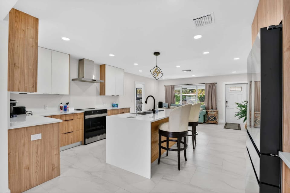 The chic, open kitchen offers ample space & all the comforts of home​