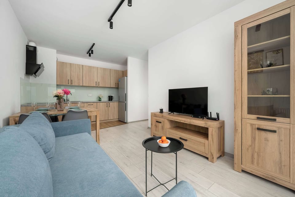 Enjoy your favorite shows on the flat-screen television in the elegant living area.
