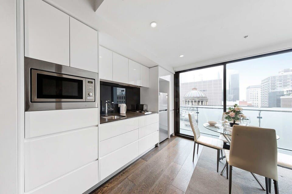 A fully decked kitchen & dining area.