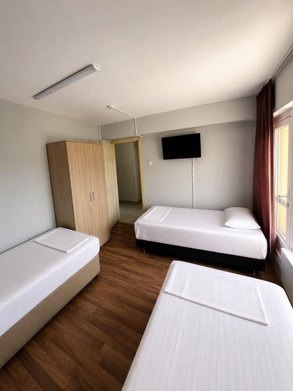 Triple Room, Balcony, City View | Desk, free WiFi