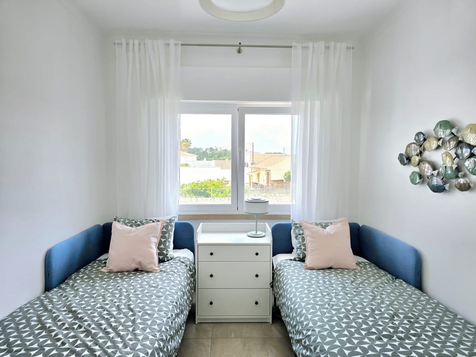 Two twin beds + wardrobe, AC/heat, roll-down black out blinds.  Crib available. 