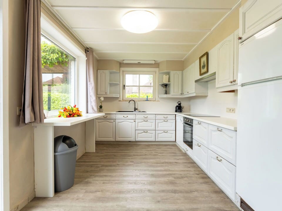 Interior Design, Kitchen, Flooring, Countertop, Wood, Cabinetry, Major Appliance, Furniture, Floor, Kitchen Appliance