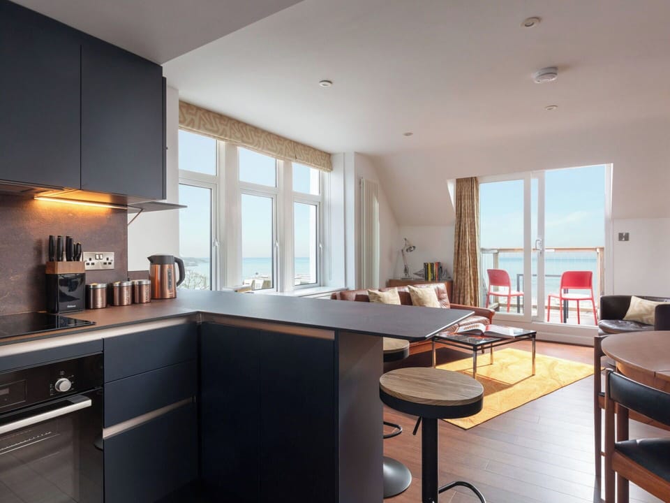 Furniture, Interior Design, Flooring, Floor, Room, Cabinetry, Apartment, Chair, Sea, Ceiling