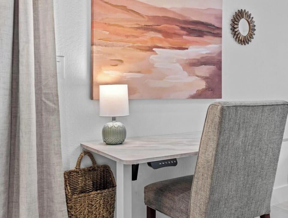 Stay productive at the dedicated sit-stand desk with high-speed Wi-Fi and warm natural light.