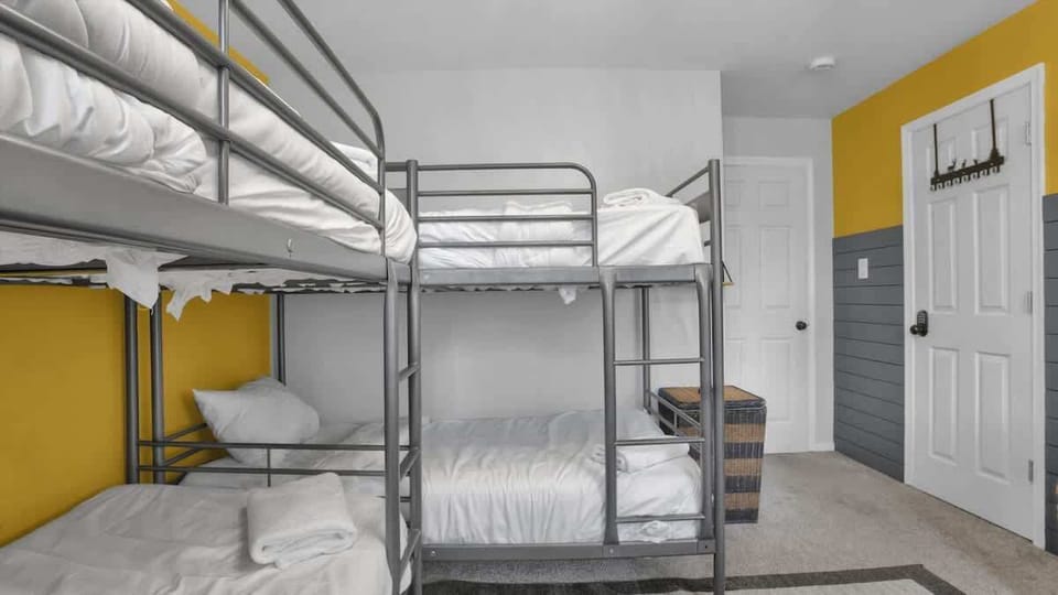 Spacious Bunk Bedroom with Multiple Beds for Groups